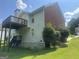 The back exterior features a chimney and a light blue siding with deck and stairs at 393 Macland Dr, Lawrenceville, GA 30045