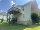 A light blue two-story home with a chimney and stairs to a deck at 393 Macland Dr, Lawrenceville, GA 30045