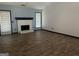 Living room with brick fireplace, wood-look floors, and lots of natural light at 393 Macland Dr, Lawrenceville, GA 30045