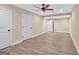 Spacious finished basement area with wood-look flooring and white doors at 3515 Chattahoochee Rd, Cumming, GA 30041