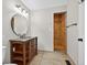 Well-lit bathroom with updated vanity, mirror and tiled, walk-in shower at 3515 Chattahoochee Rd, Cumming, GA 30041