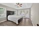 Bright bedroom with tray ceilings, natural light, wood floors and french doors at 3515 Chattahoochee Rd, Cumming, GA 30041