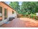 Spacious backyard deck features a fresh stain and access to the home through glass panel doors at 3515 Chattahoochee Rd, Cumming, GA 30041