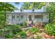 Charming home featuring a welcoming front porch and beautifully landscaped front yard at 3515 Chattahoochee Rd, Cumming, GA 30041
