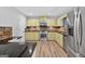 Beautiful kitchen featuring stainless steel appliances, granite countertops and updated cabinets at 3515 Chattahoochee Rd, Cumming, GA 30041