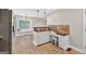 Kitchen area featuring stainless steel appliances, granite countertops, wood floors and breakfast bar at 3515 Chattahoochee Rd, Cumming, GA 30041