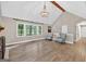 Bright living room with large windows, vaulted ceilings and light-colored walls and flooring at 3515 Chattahoochee Rd, Cumming, GA 30041