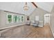 Spacious living room featuring high ceilings, wood flooring, and abundant natural light at 3515 Chattahoochee Rd, Cumming, GA 30041