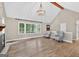 Bright living room with vaulted ceilings, hardwood floors, and a picturesque window view at 3515 Chattahoochee Rd, Cumming, GA 30041