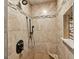 Walk-in shower featuring custom tile work, shower head and seating at 3515 Chattahoochee Rd, Cumming, GA 30041