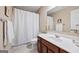 Well-maintained bathroom with a shower-tub combo, vanity, and neutral walls creates a serene space at 6142 Golf View Xing, Locust Grove, GA 30248