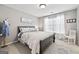 Bedroom with gray walls, white trim, and a queen-sized bed with patterned bedding at 6142 Golf View Xing, Locust Grove, GA 30248