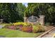 Stone Heron Bay Golf & Country Club sign surrounded by flowers and greenery on a sunny day at 6142 Golf View Xing, Locust Grove, GA 30248