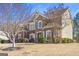 Beautiful two-story brick home with stone accents, landscaped yard, and a welcoming entrance at 6142 Golf View Xing, Locust Grove, GA 30248