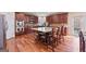 Gourmet kitchen features dark wood cabinets, granite countertops, stainless steel appliances, and large island at 6142 Golf View Xing, Locust Grove, GA 30248