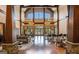 Expansive lounge with soaring ceilings, elegant chandeliers, and comfortable seating creates a luxurious ambiance for residents and guests alike at 6142 Golf View Xing, Locust Grove, GA 30248