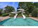 Community pool with a large water slide for Gathering fun in the sun at 6142 Golf View Xing, Locust Grove, GA 30248