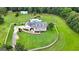Aerial view of a charming home with a pool, large yard, and white picket fence at 310 Trestle Rd, Locust Grove, GA 30248