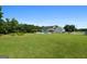 Expansive backyard featuring a pool, lush greenery, and a well-maintained fence at 310 Trestle Rd, Locust Grove, GA 30248