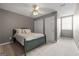 Serene bedroom with a comfortable bed, ample natural light, and neutral color scheme for relaxation at 310 Trestle Rd, Locust Grove, GA 30248