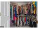 Walk-in closet featuring ample shelving and storage for clothing and accessories at 310 Trestle Rd, Locust Grove, GA 30248