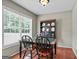 Dining area with a charming hutch, tile table, and bright natural light at 310 Trestle Rd, Locust Grove, GA 30248