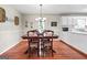Inviting dining room with hardwood floors and classic decor and cabinets at 310 Trestle Rd, Locust Grove, GA 30248