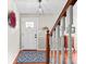 Inviting foyer with hardwood floors, a decorative rug, and a charming chandelier at 310 Trestle Rd, Locust Grove, GA 30248