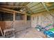 Interior of a horse stall with wooden beams, metal bars, and functional design at 310 Trestle Rd, Locust Grove, GA 30248
