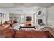 Bright living room featuring a brick fireplace and comfortable leather furniture at 310 Trestle Rd, Locust Grove, GA 30248