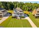 Aerial view of home highlighting the spacious lot, mature trees, and proximity to neighborhood amenities at 27 Riverview, Euharlee, GA 30145