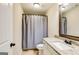 Functional bathroom features a vanity with granite counter, framed mirror, toilet, and shower with curtain at 27 Riverview, Euharlee, GA 30145