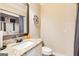Bathroom featuring a marble countertop, sink, and toilet at 27 Riverview, Euharlee, GA 30145