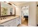 Elegant bathroom with granite countertop double vanity, decorative mirror, and shower reflected in the mirror at 27 Riverview, Euharlee, GA 30145