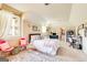 Carpeted bedroom with sloped ceilings, a bed, window and a view into the attached bathroom at 27 Riverview, Euharlee, GA 30145