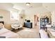 Comfortable carpeted bedroom with a gray dresser, chair, and desk with an attached bathroom at 27 Riverview, Euharlee, GA 30145