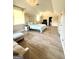 Spacious bedroom with a sitting area, hardwood floors, and ensuite bathroom access at 27 Riverview, Euharlee, GA 30145