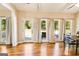 Sunlit dining area with hardwood floors, exterior access, and a view to the deck at 27 Riverview, Euharlee, GA 30145
