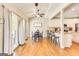Bright dining area open to the kitchen, featuring hardwood floors and outdoor views at 27 Riverview, Euharlee, GA 30145