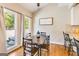 Dining area with hardwood floors, natural light, and view of the outdoor deck at 27 Riverview, Euharlee, GA 30145
