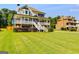 Inviting two-story home with a large porch, crisp white railings, and lush green lawn at 27 Riverview, Euharlee, GA 30145