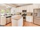 A kitchen featuring stainless steel appliances, granite countertops, and hardwood floors at 27 Riverview, Euharlee, GA 30145