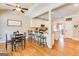 Open-concept kitchen with a breakfast bar and dining area, featuring hardwood floors at 27 Riverview, Euharlee, GA 30145