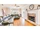 Cozy living room showcasing a stone fireplace, hardwood floors, and natural light at 27 Riverview, Euharlee, GA 30145
