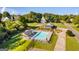 Aerial view of community pool and pool house surrounded by lush greenery at 27 Riverview, Euharlee, GA 30145
