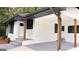 Side view of house featuring covered carport and freshly painted white facade at 5324 Joan Of Arc, Atlanta, GA 30349