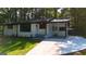 Charming house with a freshly poured driveway and well-maintained lawn at 5324 Joan Of Arc, Atlanta, GA 30349