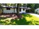Charming renovated ranch with freshly landscaped lawn and covered entry at 5324 Joan Of Arc, Atlanta, GA 30349
