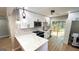 Modern kitchen with white cabinets, marble countertops, stainless steel appliances, and a breakfast bar at 5324 Joan Of Arc, Atlanta, GA 30349