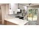 Modern kitchen boasting white cabinets, quartz countertops, and stainless appliances at 5324 Joan Of Arc, Atlanta, GA 30349